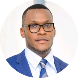 Professional headshot of a man wearing glasses, blue blazer, and blue striped tie against a white circular background.