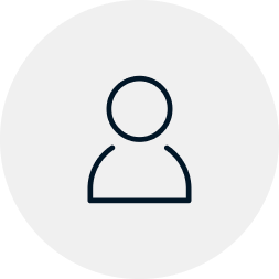 Generic user profile icon with a circular head and shoulders silhouette in dark blue on a light gray background.